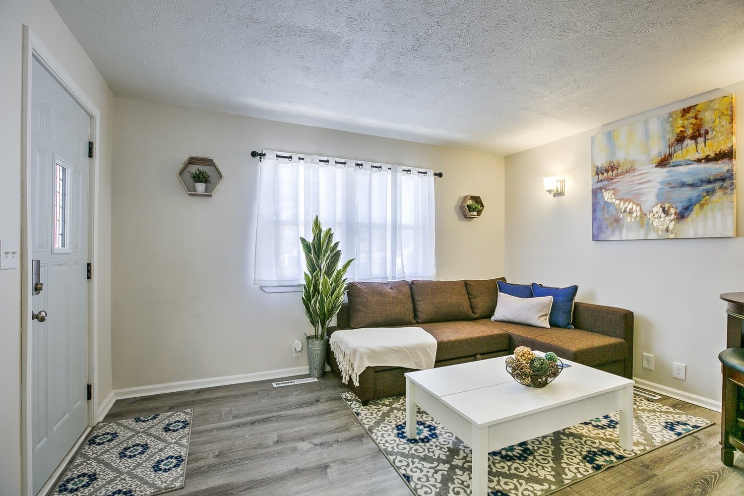 Living Room staged by Acorn Home Staging — Vacation Rental Design
