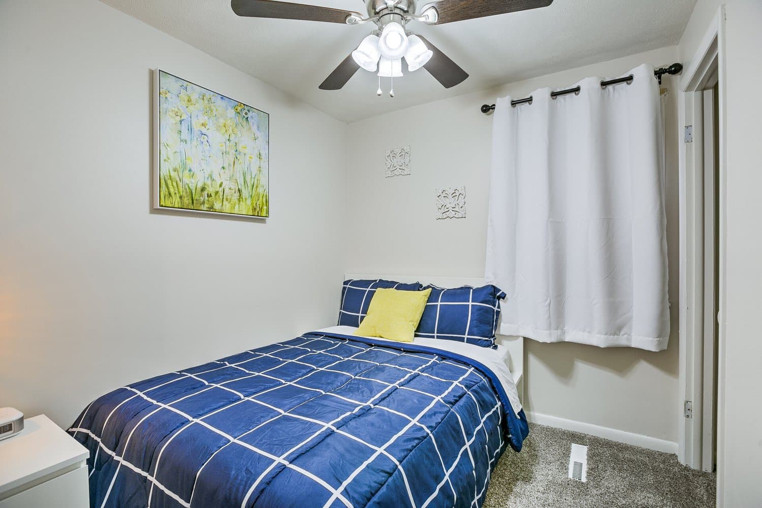 Bedroom staged by Acorn Home Staging — Vacation Rental Design